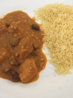Una foto de Pollo con especias y frutos secos