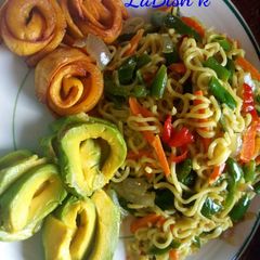 A picture of Noddles with avacado and fried plantain.