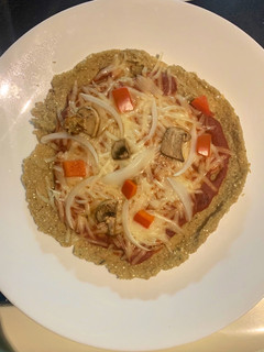 Una foto de Pizza de quinua