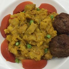 A picture of Half ripe plantain porriage with meat balls.