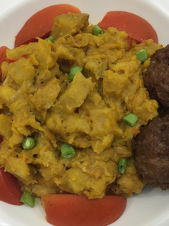 A picture of Half ripe plantain porriage with meat balls.