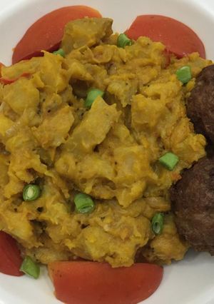 A picture of Half ripe plantain porriage with meat balls.
