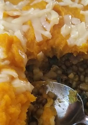 Una foto de Dhal de Porotos Mung con cobertura de Zapallo