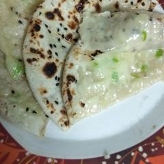 A picture of Chilli Cheese Stuffed Kulcha On Tava.
