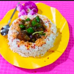 A picture of Chilli chicken with rice.