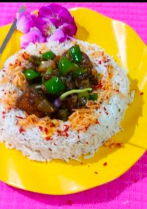 A picture of Chilli chicken with rice.