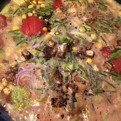 A picture of 925.California Farm Manhattan Salmon Crab Soup with Tofu Croutons.