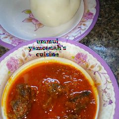 Pounded yam with stew A picture of Pounded yam with stew.