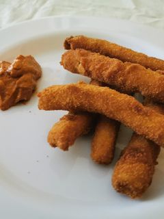 Una foto de Calçots arrebossats amb pa ratllat