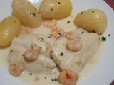 Lomos de merluza en salsa de cebolla con nata
