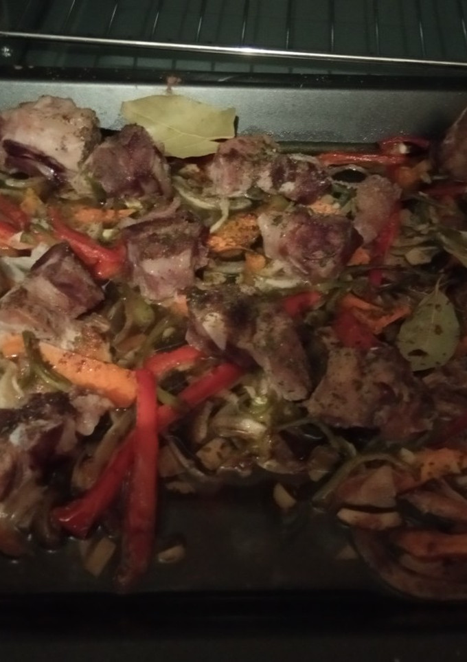 Una foto de Costillar en cama de verduras