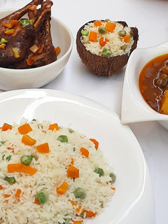 A picture of Coconut rice with chicken soup.