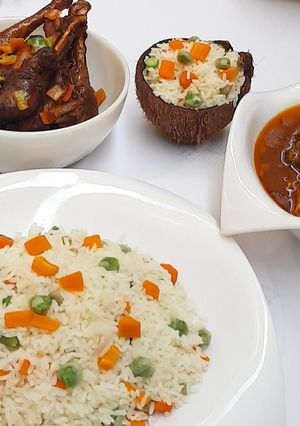 A picture of Coconut rice with chicken soup.