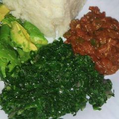 A picture of Wet beef fry, veges with ugali.