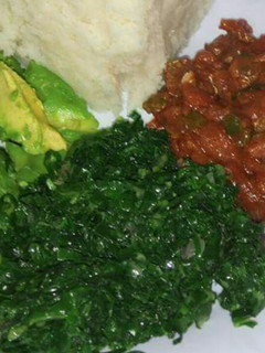 A picture of Wet beef fry, veges with ugali.