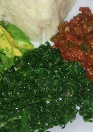 A picture of Wet beef fry, veges with ugali.
