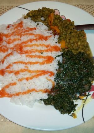 A picture of Boiled Rice Green grams stew and fried sukuma wiki.