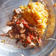 A picture of Simple steamed cabbages alongside fried liver.