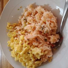 A picture of Fried Rice with scrambled eggs.