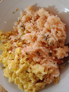 A picture of Fried Rice with scrambled eggs.