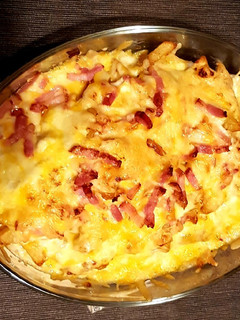 Una foto de Patatas con queso y bacon estilo Fosters Hollywood