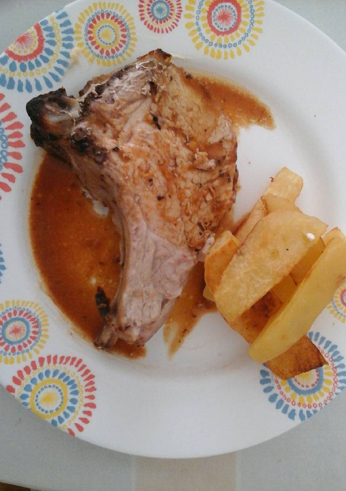 Una foto de Lomo con mostaza, miel y naranja