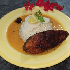 A picture of Daal Chawal with fry Fish.
