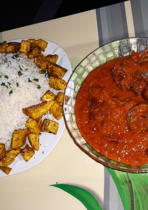 A picture of White Rice and Assorted Meat Stew.