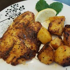 A picture of Grilled fish and potatoes.