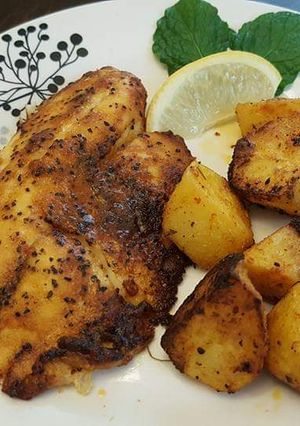 A picture of Grilled fish and potatoes.