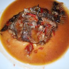 A picture of Fried fish with soup.