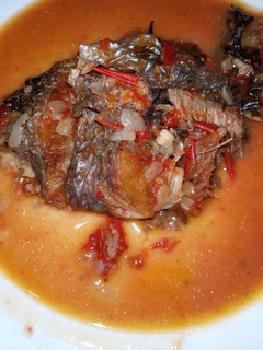 A picture of Fried fish with soup.