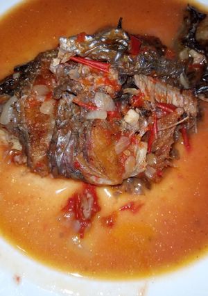 A picture of Fried fish with soup.