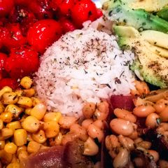 A picture of Rice Bowl with Avocado, Corn, White Beans and Cherry Tomatoes (Vegan).