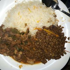 A picture of Lentils (kamande) served with goatmeat and rice.