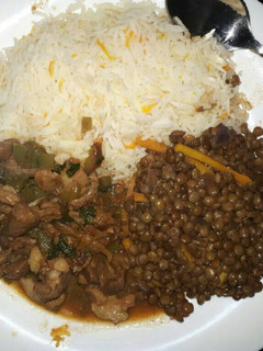 A picture of Lentils (kamande) served with goatmeat and rice.