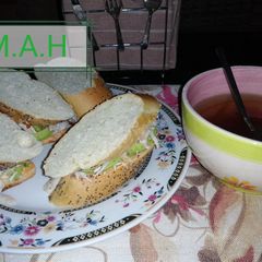 A picture of Chichen, avocado sandwich.