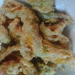 A picture of Cheese stuffed zucchini blossoms.