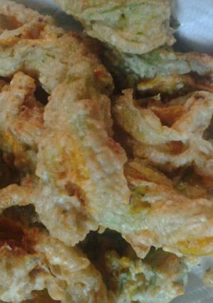 A picture of Cheese stuffed zucchini blossoms.