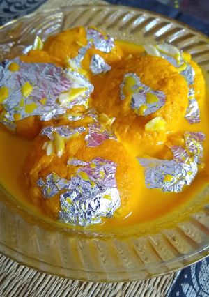 A picture of Orange rasmalai.