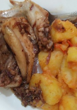 A picture of Spiced chicken with spiced potatoes.