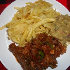 French fries, fried mutton & guacamole A picture of French fries, fried mutton & guacamole.