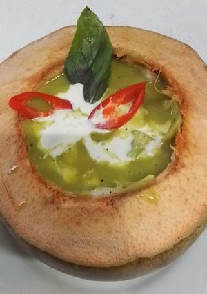 A picture of Green Curry Chicken in Young Coconut.