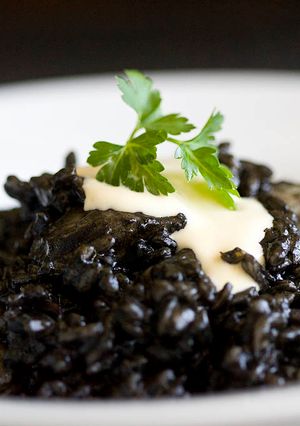 A picture of Black Rice with Cuttlefish and Aioli Sauce.