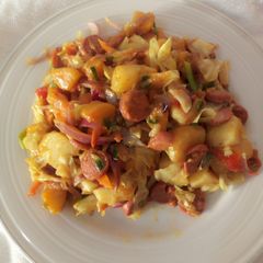 A picture of Plantain and Irish potatoes in curry veggies.