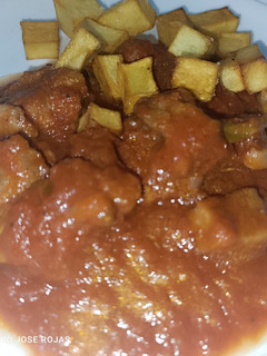 Una foto de Carne de cerdo con tomate