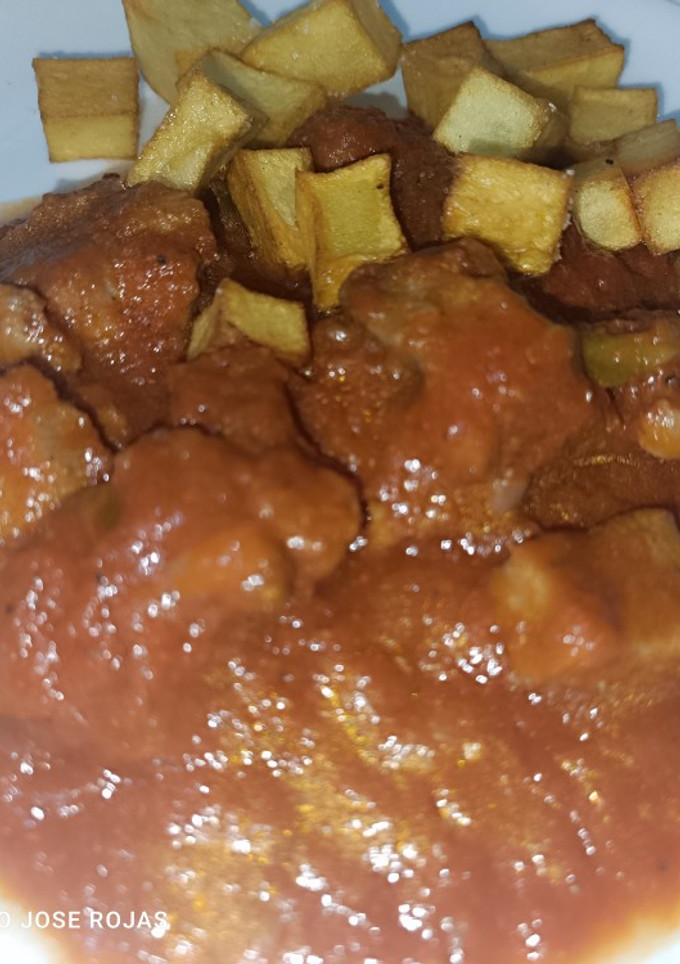 Una foto de Carne de cerdo con tomate