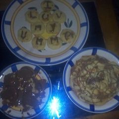 A picture of Semolina cookies with chocolate syrup.