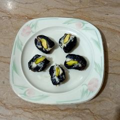 A picture of Dates filled with cream and pista.