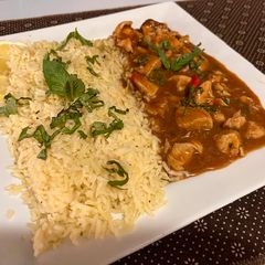A picture of Thai basil chicken with lemon basil rice.